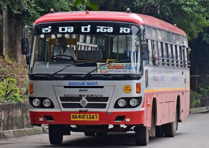 Karnataka Bus Fare Hike Conductor issuing electronic ticket to commuter